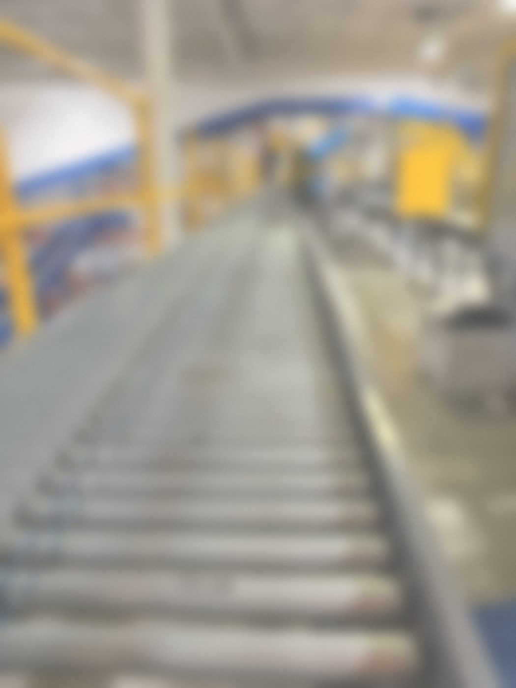 Powered roller conveyor with yellow guarding