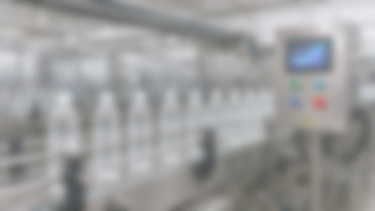 Packaging line with bottles and a stainless operator station